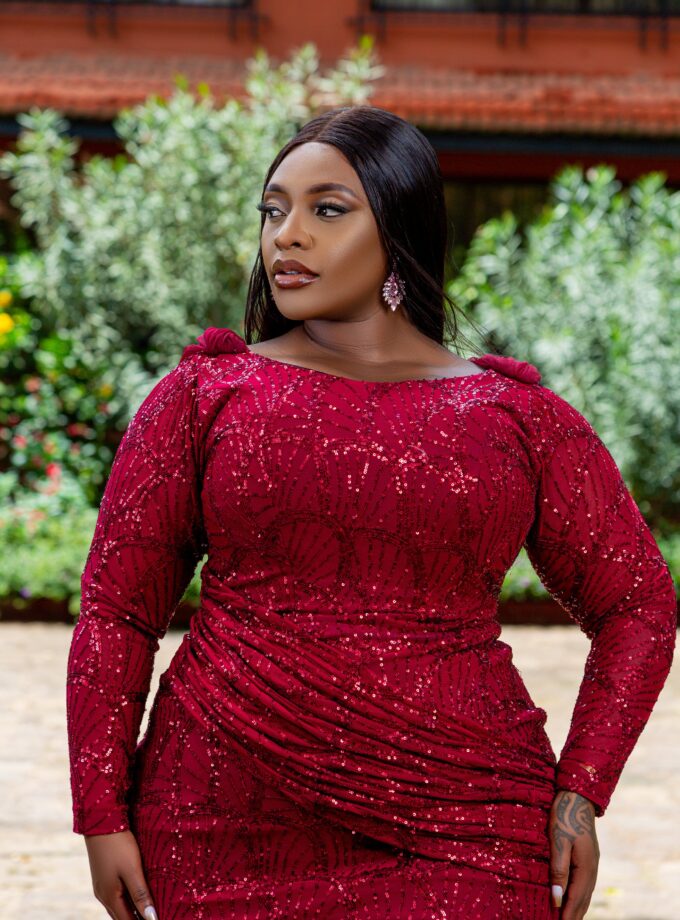 Mermaid sequin lace gown with feathers.