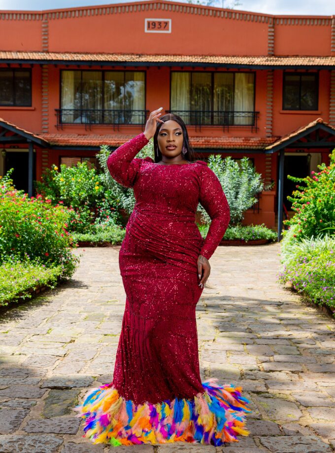 Mermaid sequin lace gown with feathers.